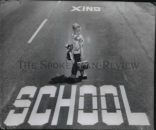 1959 Press Photo Kid Crossing the Street Near School, Spokane