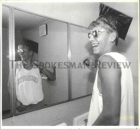 1992 Press Photo Post Falls School senior Greg Rowley tries on graduation cap