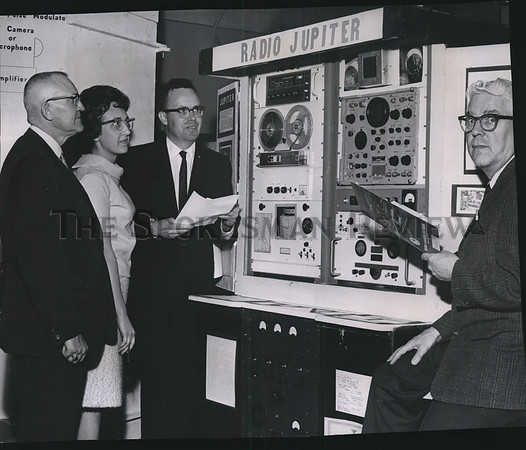 1966 Press Photo Fair judges listen to the sound of Jupiter at Science Fair