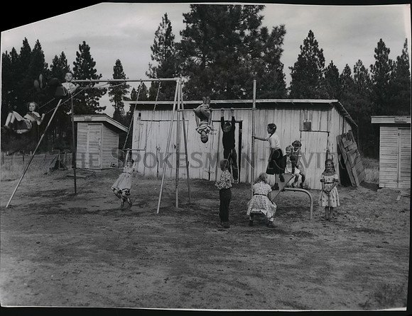 1955 Press Photo children on swing set at school