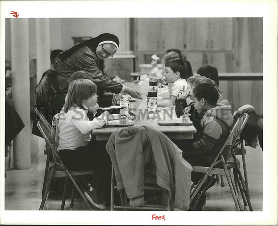 1989 Press Photo St. Patrick Parochial School nun helps students with their meal