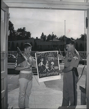 1963 Press Photo State Trooper Walter F. Mathers with Ron Irving holding Sign