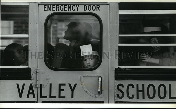 1988 Press Photo Rachel Keen, wearing a headband as she peers from a bus