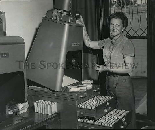 1956 Press Photo Elvin Bunker operator of the public schools microfilm equipment