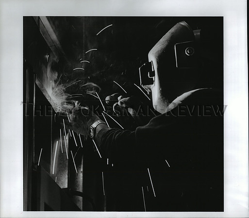 1994 Press Photo Performance spot-weld contractor Chris Tucker works at a school