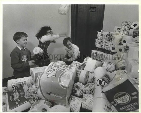 1993 Press Photo Kids play with the collected toilet paper at Assumption School