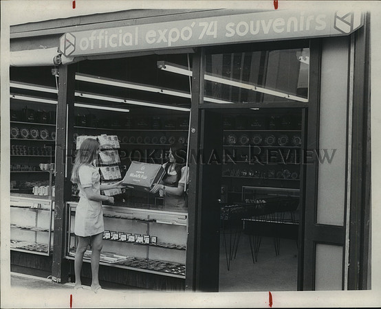 1974 Press Photo Two Expo '74 employees at a fair souvenir shop