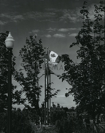 1976 Press Photo Canada's Maple Leaf flies beside the Stars and Stripes, Spokane
