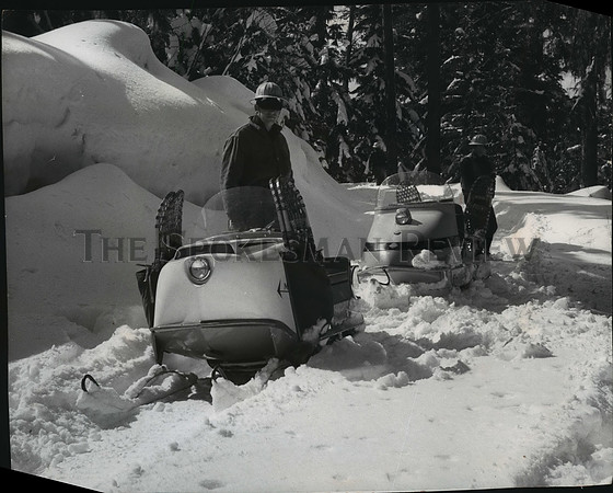 1966 Press Photo Snowmobiles transport foresters to a winter work area in C.D.A.