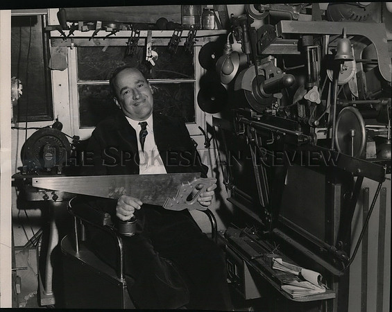 1953 Press Photo Polio victim uses his head to make filing business pay.