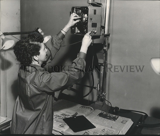 1957 Press Photo Mrs. Douglas Glover adjusts filing camera at Spokesman Review