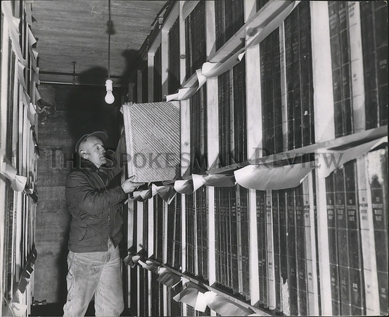 1957 Press Photo Ed Parker stores newspaper files in a Millwood vault